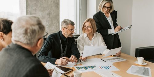 A diverse group of business professionals engaged in a strategic meeting.